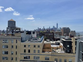 Buildings in city against sky