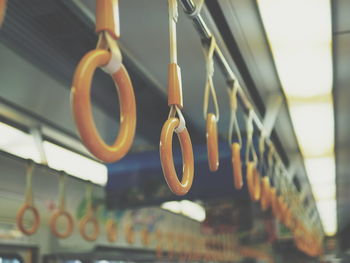 Close-up of clothes hanging on store