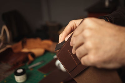 Cropped hands of man working at workshop