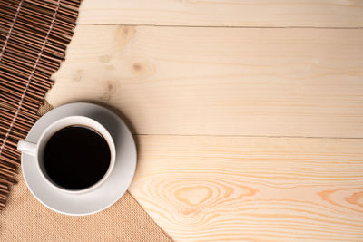 High angle view of coffee cup on table