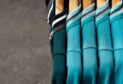 Close-up of t-shirts hanging at market stall