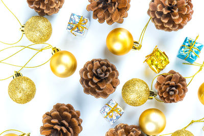 Directly above shot of christmas decorations over white background