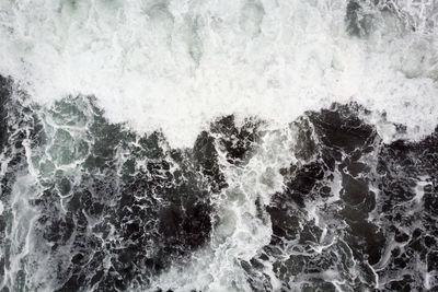 Full frame shot of waves splashing in sea