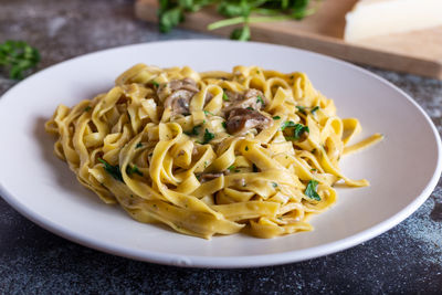 Italian fettuccine pasta with porcini mushrooms. italian pasta. vegetarian dish.