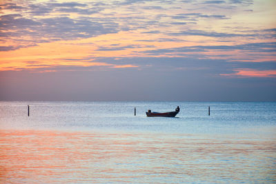 Scenic view of sea at sunset