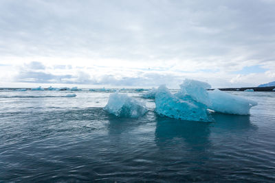 Scenic view of sea against sky during winter