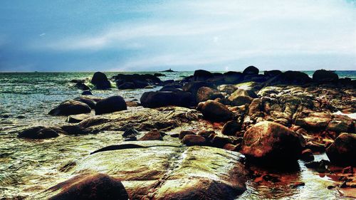 Scenic view of sea against cloudy sky