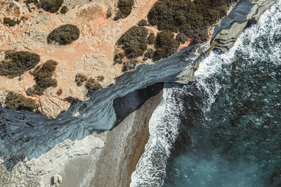 High angle view of rocks in sea