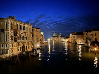 Buildings in city at night