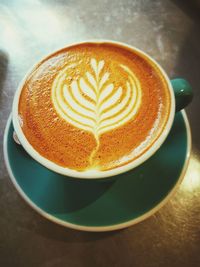 High angle view of cappuccino on table