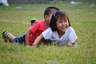 Playful siblings on field