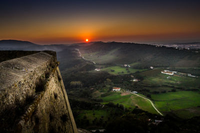 Scenic view of landscape against sky during sunset