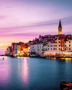 Illuminated buildings in city at sunset rovinj croatia 