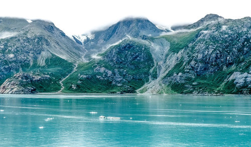 Scenic view of lake with mountains in background