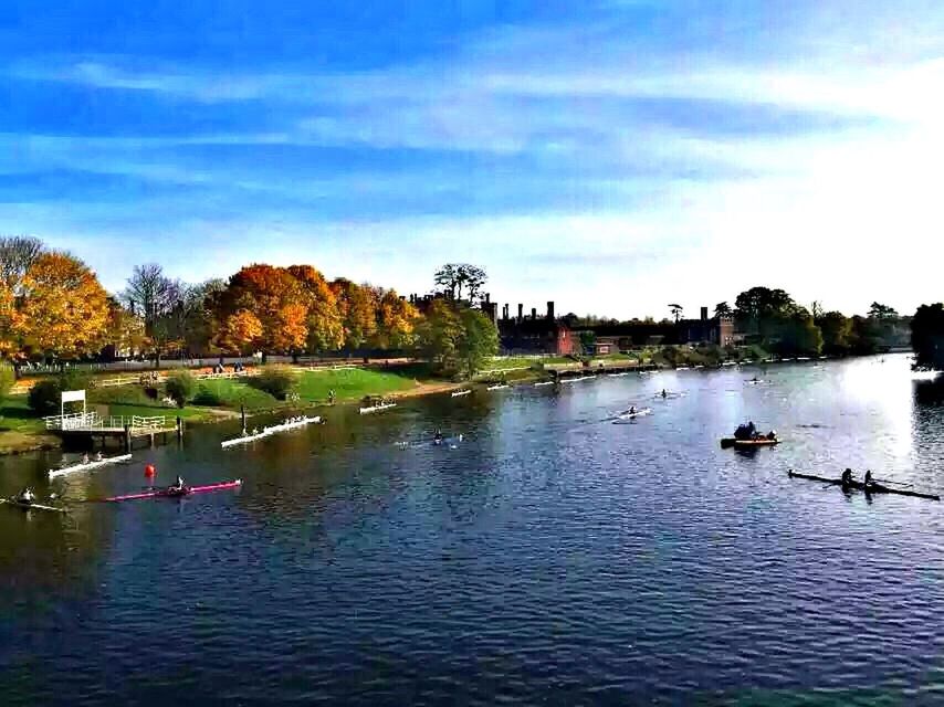 water, tree, waterfront, lake, sky, river, building exterior, built structure, architecture, large group of people, nautical vessel, nature, tranquility, tranquil scene, scenics, cloud - sky, transportation, beauty in nature, animal themes