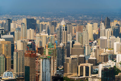 High angle view of buildings in city against sky