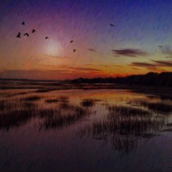 Scenic view of lake against sky during sunset