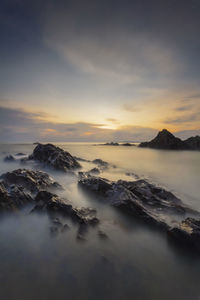 Scenic view of sea against sky during sunset