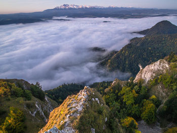 Scenic view of sea and mountains against sky