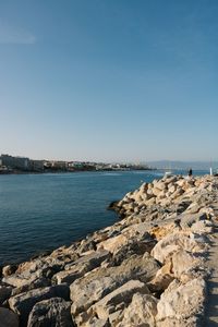 Scenic view of sea against clear blue sky