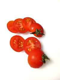 Close-up of red berries against white background