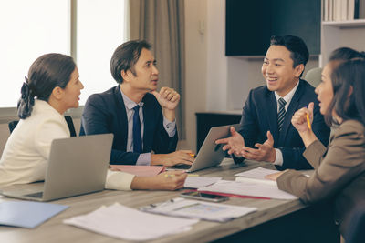 Business colleagues working at office