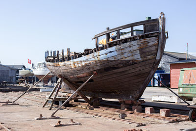 Boats moored at harbor