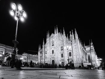 Panoramic view of illuminated buildings in city at night