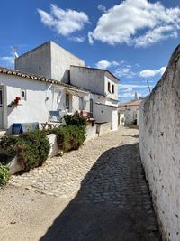 Footpath amidst buildings in town