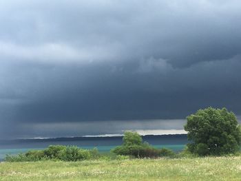 Scenic view of sea against cloudy sky