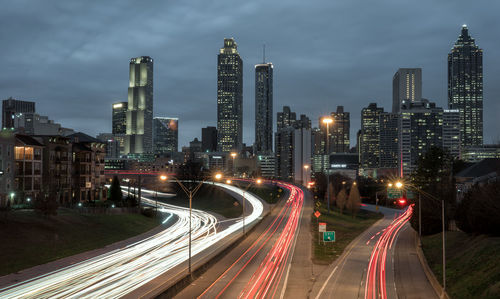 High angle view of light trails on road at night