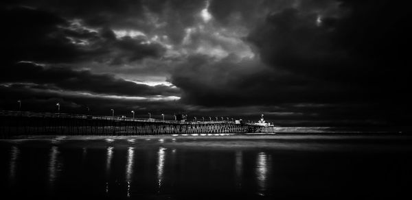 Scenic view of sea against storm clouds