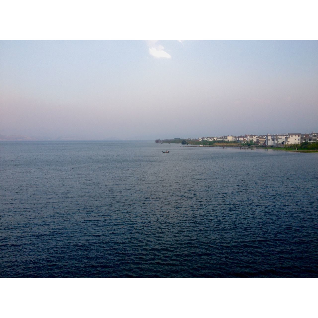 transfer print, water, sea, auto post production filter, tranquil scene, scenics, horizon over water, tranquility, sky, waterfront, beauty in nature, nature, rippled, idyllic, seascape, calm, ocean, outdoors, no people, blue