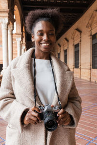 Portrait of happy man photographing