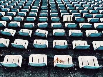 High angle view of empty chairs in old stadium