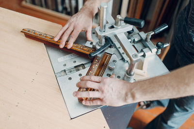 Cropped image of man working on table