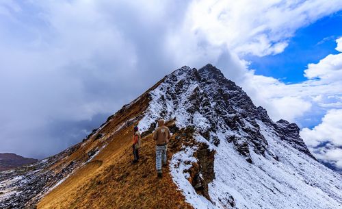 Panoramic view of snowcapped mountains against sky