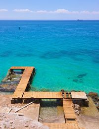 High angle view of pier by sea against sky