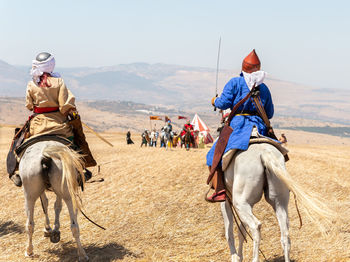 People riding horses