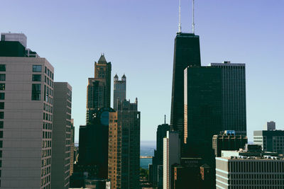 Modern buildings in city against sky