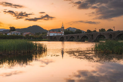 Sunset at the medieval bridge at ponte de lima, portugal.