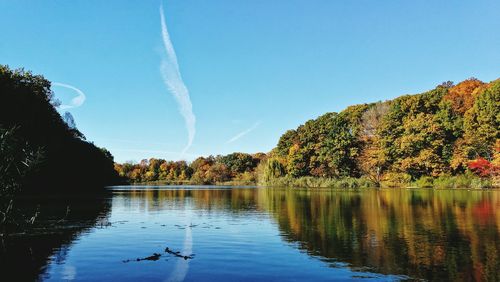 Scenic view of lake against blue sky