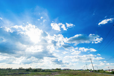 Low angle view of cables against blue sky