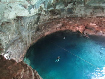 High angle view of people swimming in sea