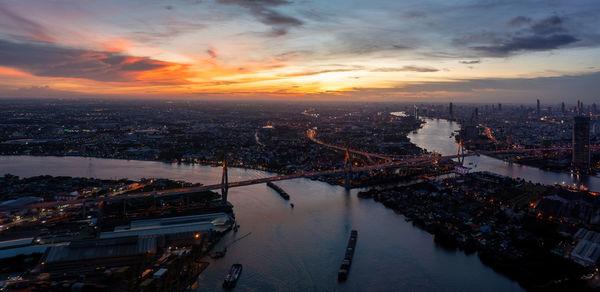 High angle view of city at sunset