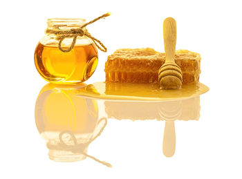 Close-up of cake on table against white background