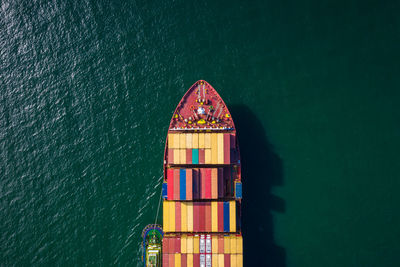 High angle view of multi colored building by sea