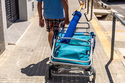 Low section of man walking on railway bridge