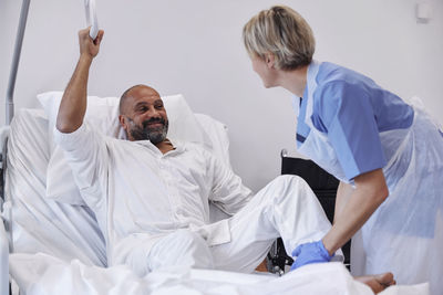 Nurse taking care of patient in hospital