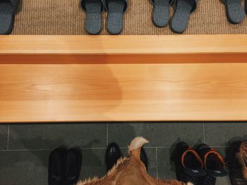 Low section of woman standing on tiled floor